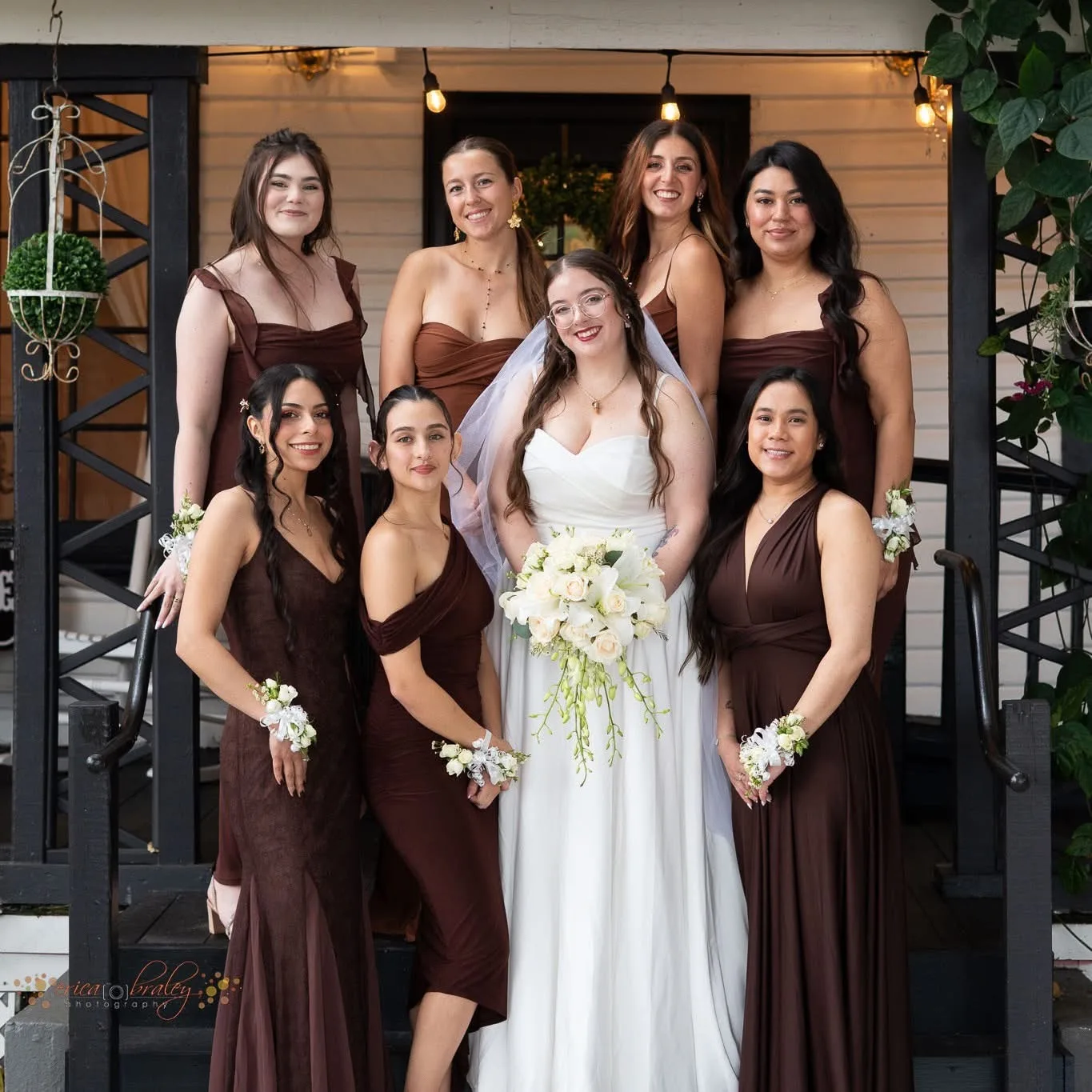 Bridal party posing on the front porch of The Tree House